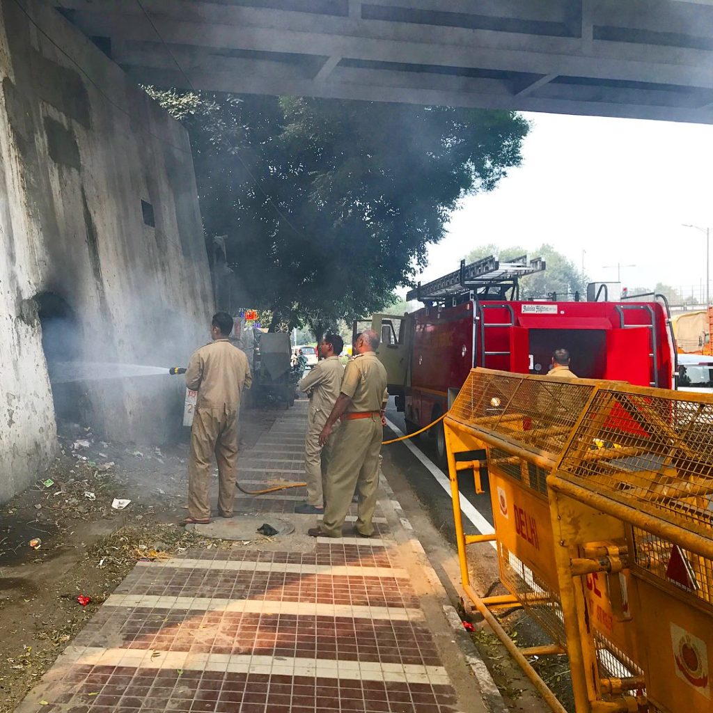 Extinguishing the man made fires. New Delhi Nature Society NGO makes sure that the city can breath cleaner air. Stopping smoke in every possible way.